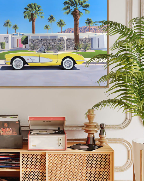 Experience the nostalgia of mid-century Palm Springs with artwork of a classic convertible outside a stylish home in a room inspired by "Don't Worry Darling".