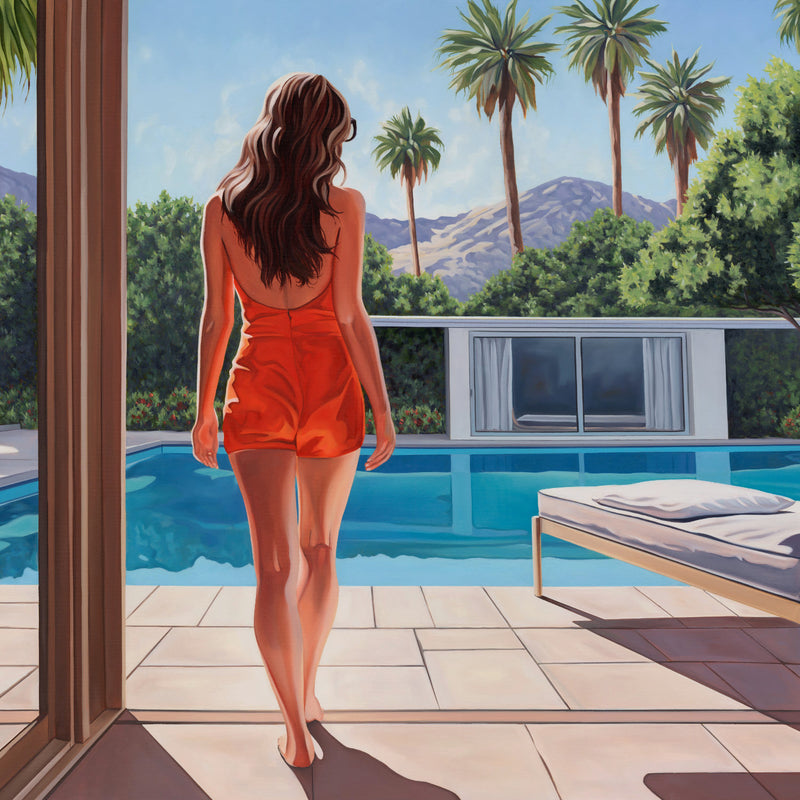 An elegant woman stands poolside, basking in California's morning sun amidst lush palm trees, embodying serene relaxation.