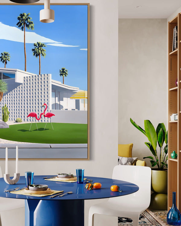 Vibrant artwork in a mid-century room captures two pink flamingos, palm trees, cactus gardens, and an architecturally designed mid-century modern home