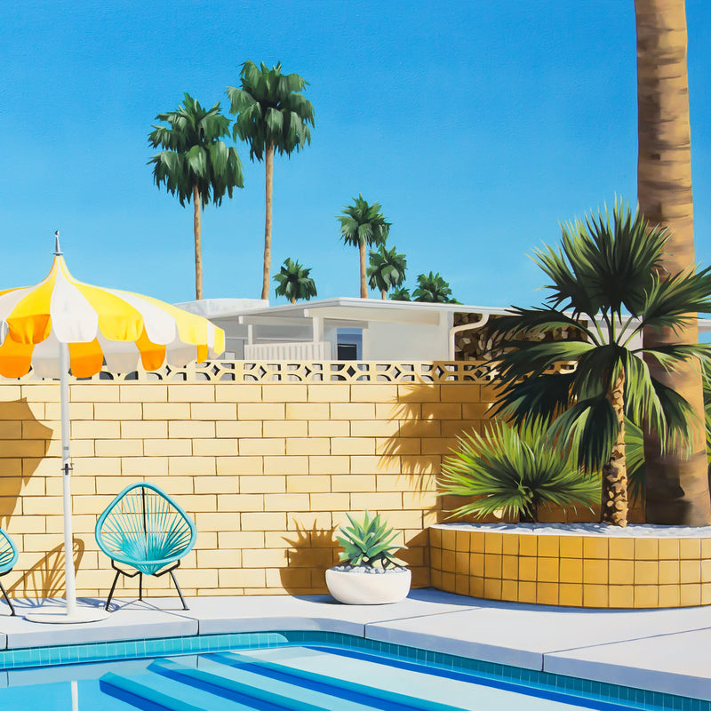 Painting of a serene pool oasis, complete with a fun pink pool ring and a stylish yellow and white striped umbrella set against the stunning Palm Springs landscape.