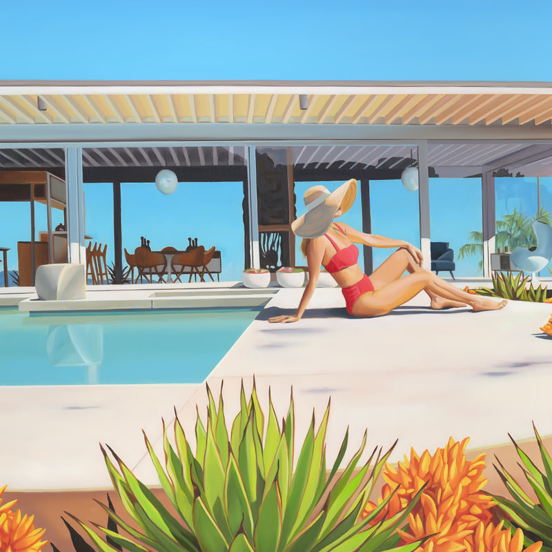 Stahl House artwork and an awe-inspiring Los Angeles skyline view, with a woman in a stylish bikini and floppy hat soaking up the sun poolside