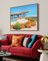 A stunning room with a breathtaking artwork depicting a woman in a bikini and floppy hat, lounging beside a sparkling pool and admiring the panoramic Los Angeles cityscape