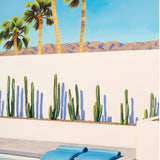 Artfully arranged pool floats evoke a sense of whimsy and relaxation in the midst of a Palm Springs oasis