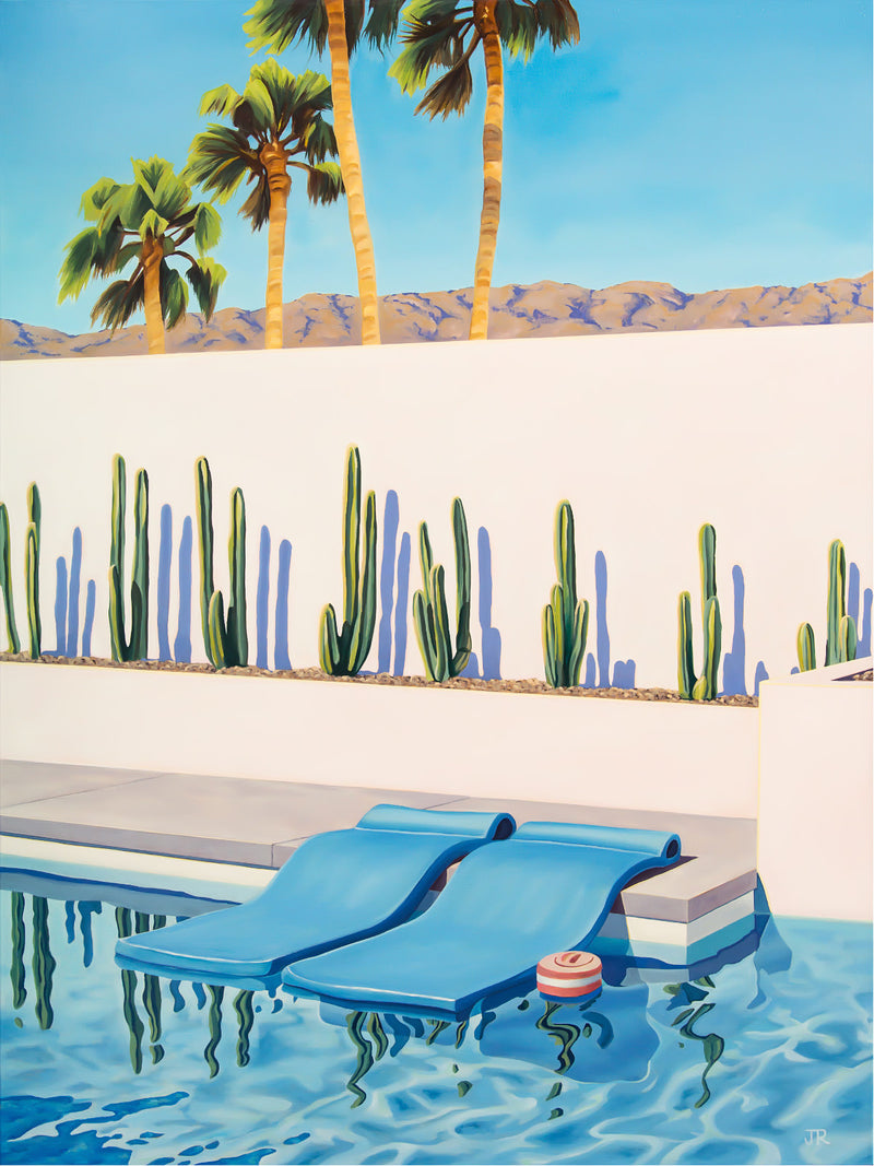 A picturesque tableau of relaxation and recreation, showcasing pool floats in a stylishly designed Palm Springs poolside setting